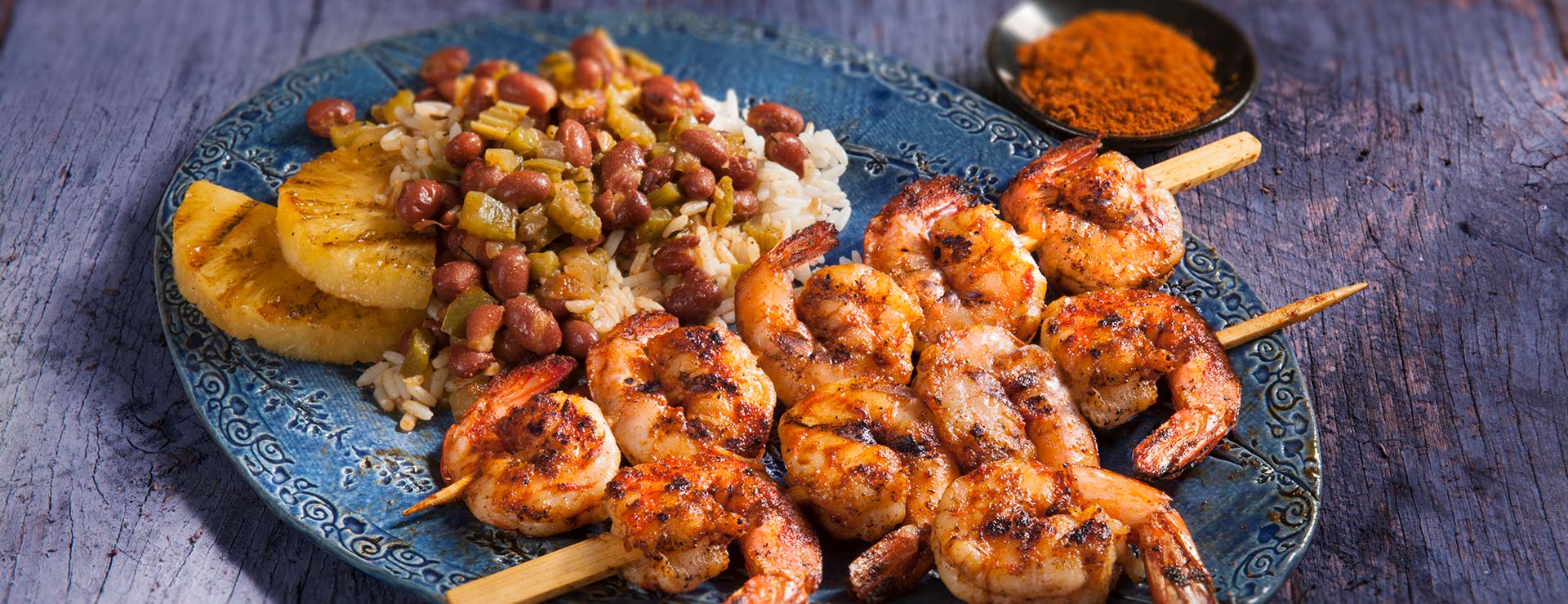 Spicy Shrimp Skewers Served with Red Beans and Rice
